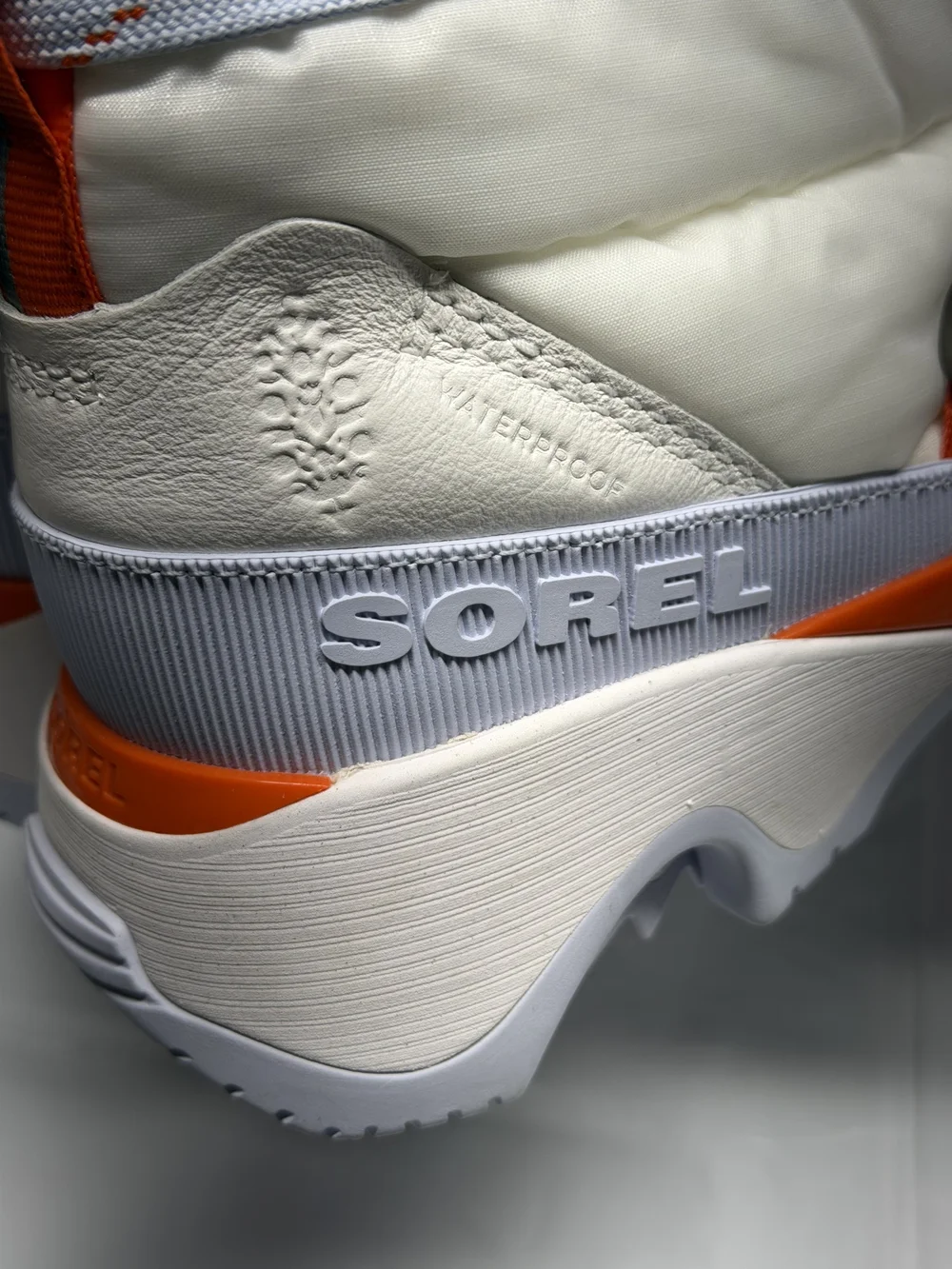 Sorel Women's White Winter Puffer Boots with Light Blue Laces and Orange Accents